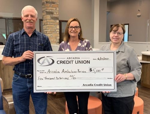 Arcadia Credit Union with a check for Arcadia Ambulance Service