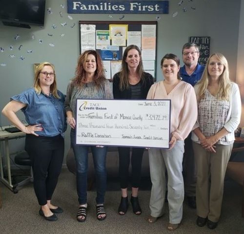 Tomah Area Credit Union with a check for Families First of Monroe County